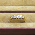 Gold ring with diamonds on a jewelry box