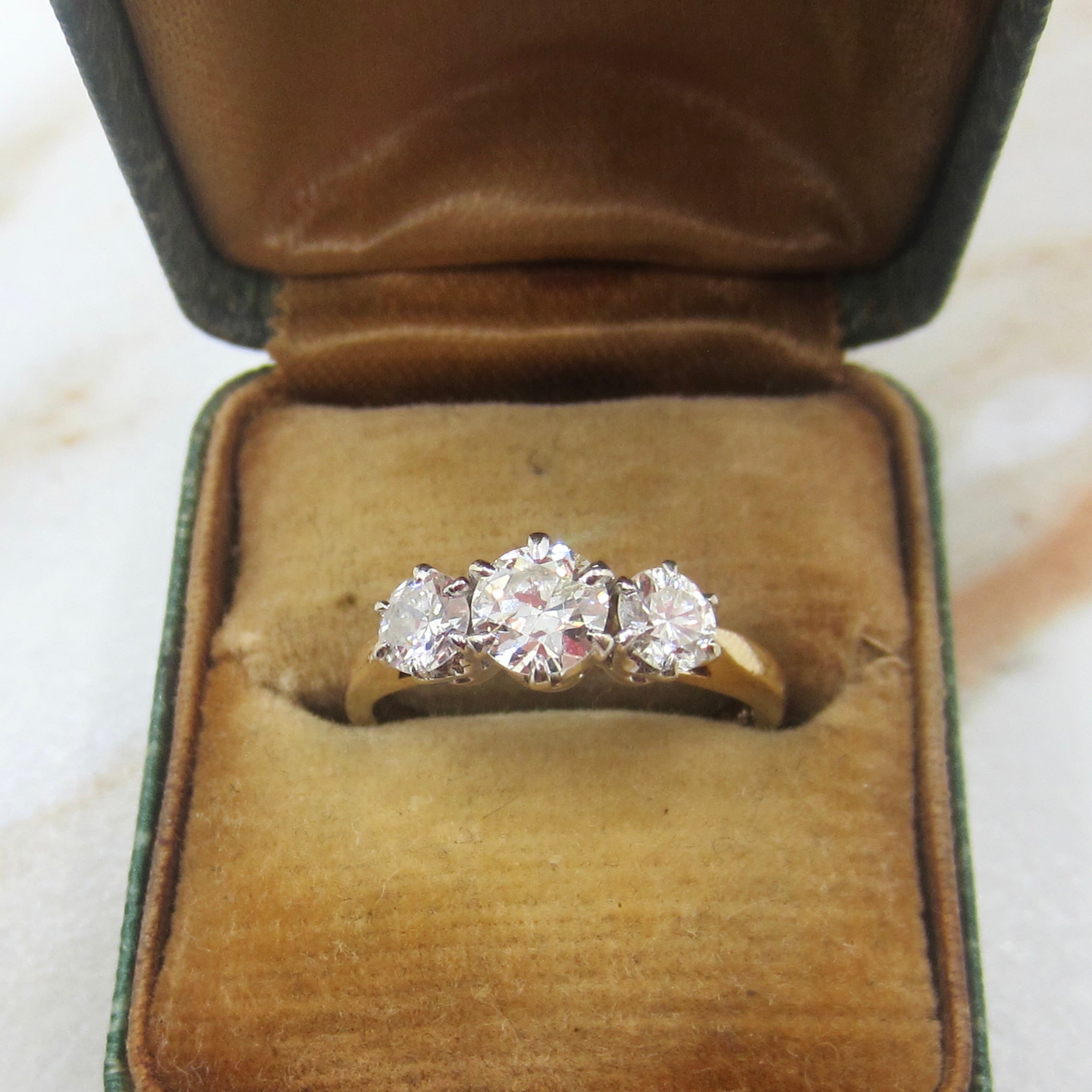 Diamond ring in an open vintage jewelry box