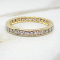 Gold ring with diamonds on a light background